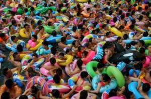Locals flock to community pool to seek relief from the heat.