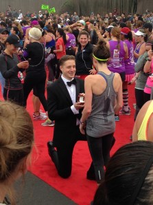 Matt purposes to Leanne at the finish of the NIKE Women's 1/2 Marathon.